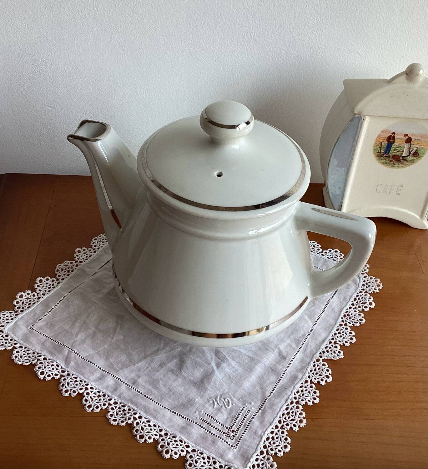 Antique porcelain coffee pot with stamped fire