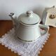 Antique porcelain coffee pot with stamped fire