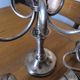 Ercuis pair of candlesticks model Cheverny in silver-plated metal with hunting horn decoration.