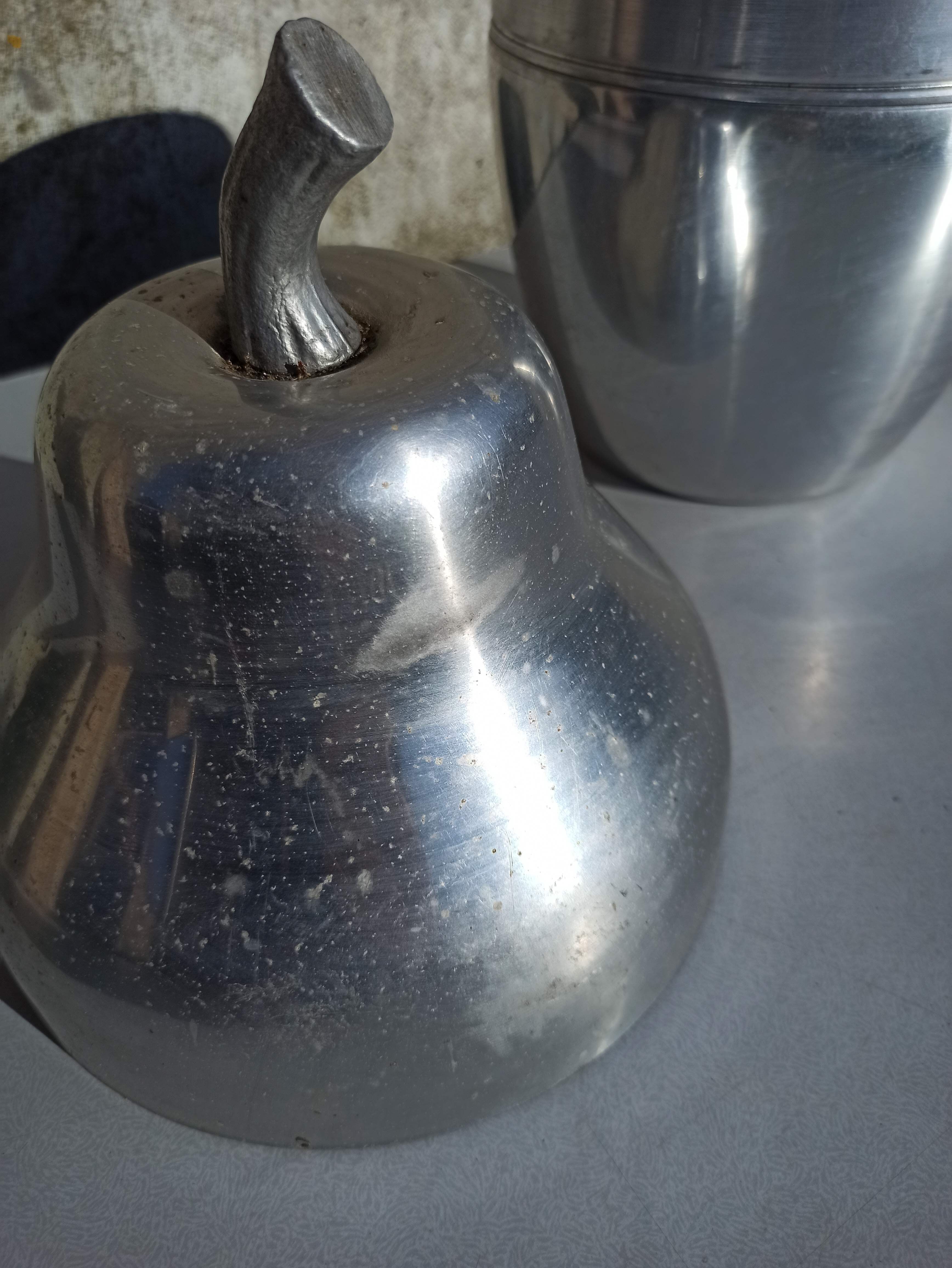 Old ice bucket ice cube in the shape of aluminum pear