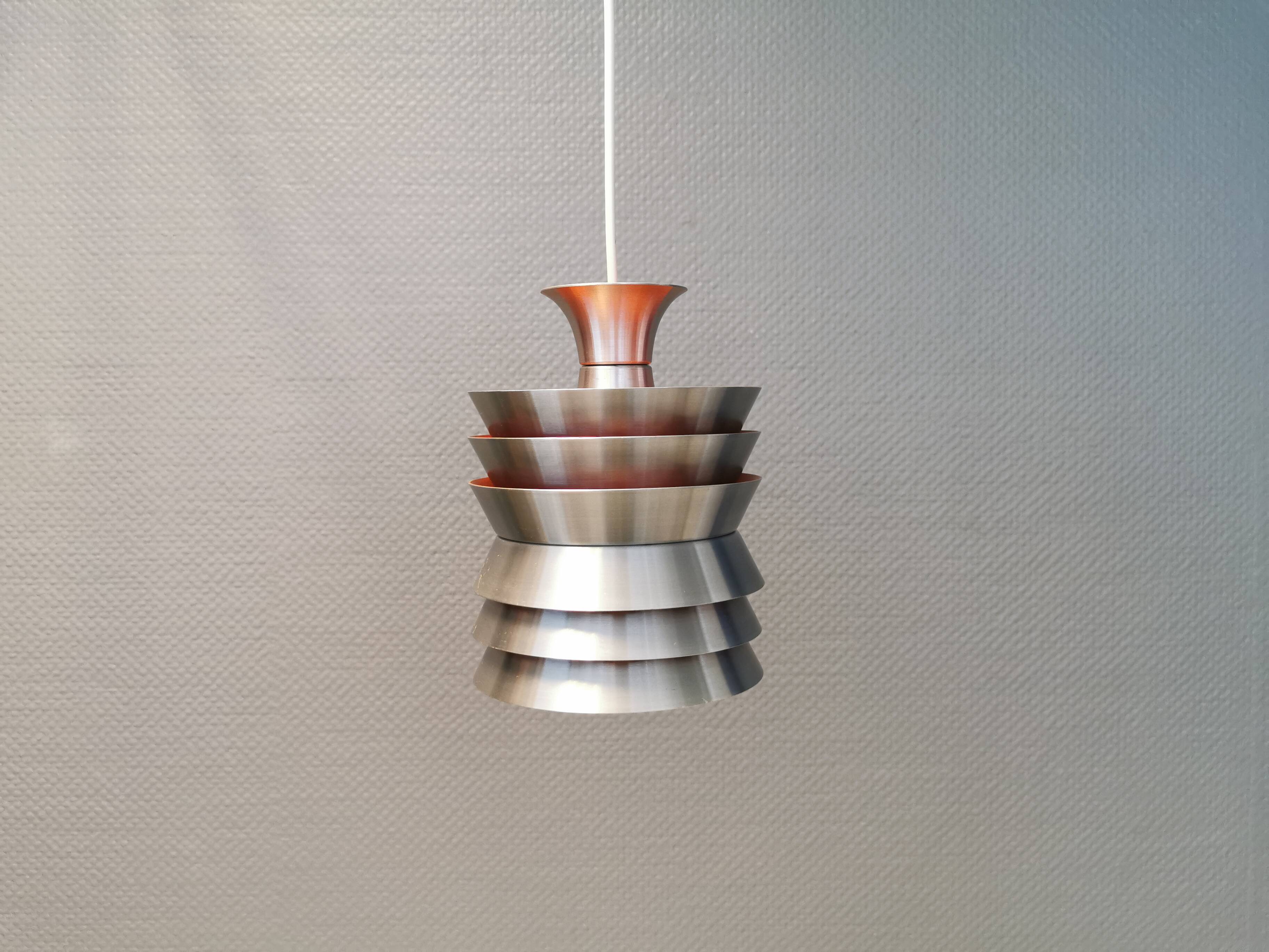 Danish/Swedish hanging lamp, in silver-coloured aluminium with orange interior paint.