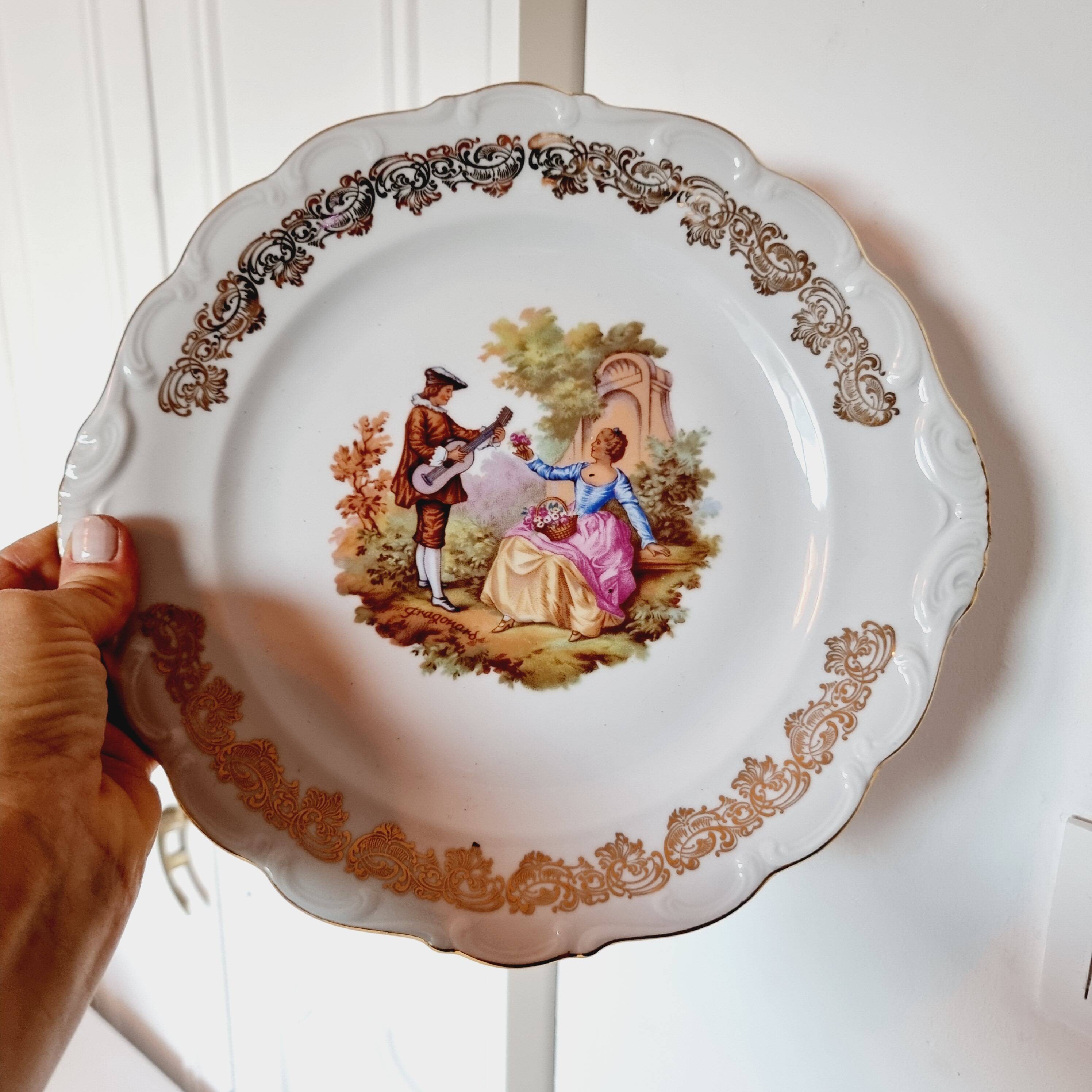 Large serving plate with romantic Frangonard scene with 24 carat gold