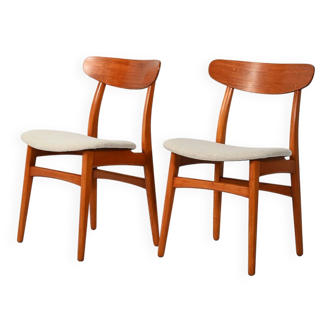 Pair of vintage teak chairs with a curved backrest