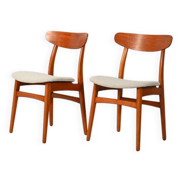 Pair of vintage teak chairs with a curved backrest