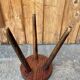 Wooden tripod stool.