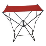Folding stool in red canvas but unstitched on one side