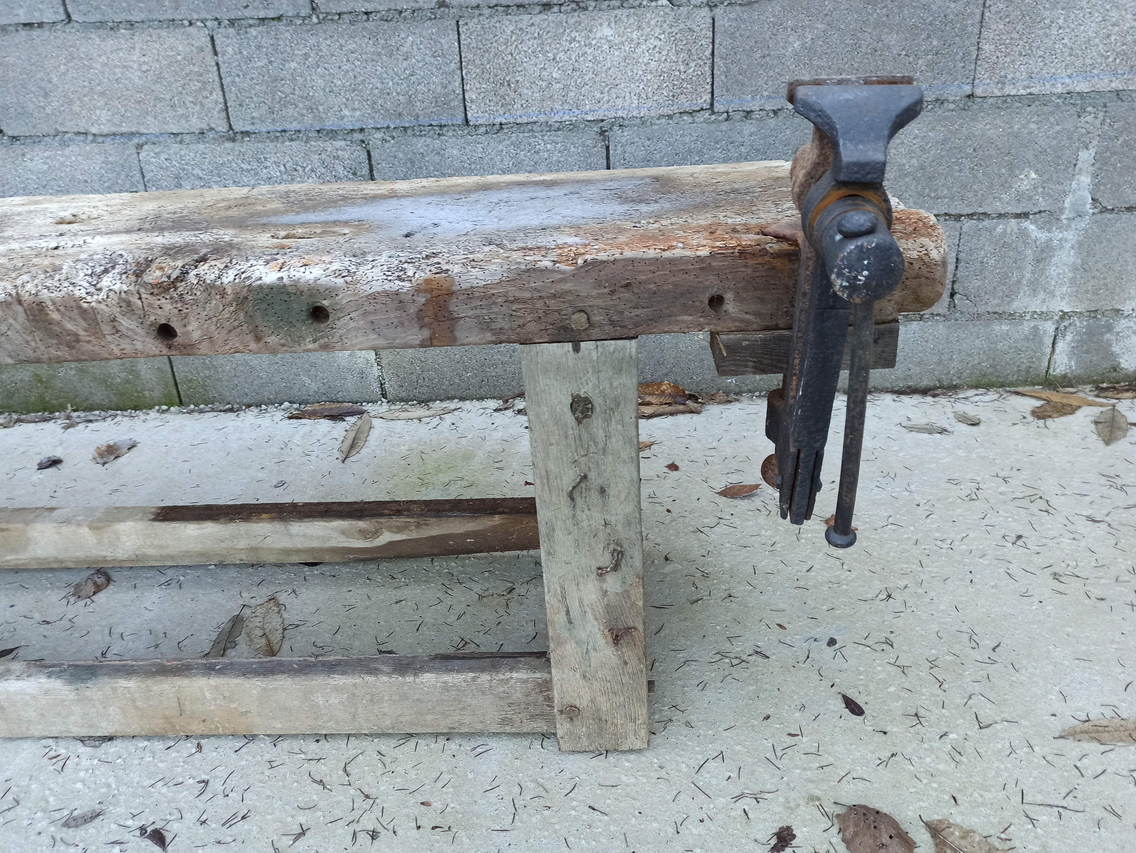 Wooden carpenter's workbench with iron and wooden vice