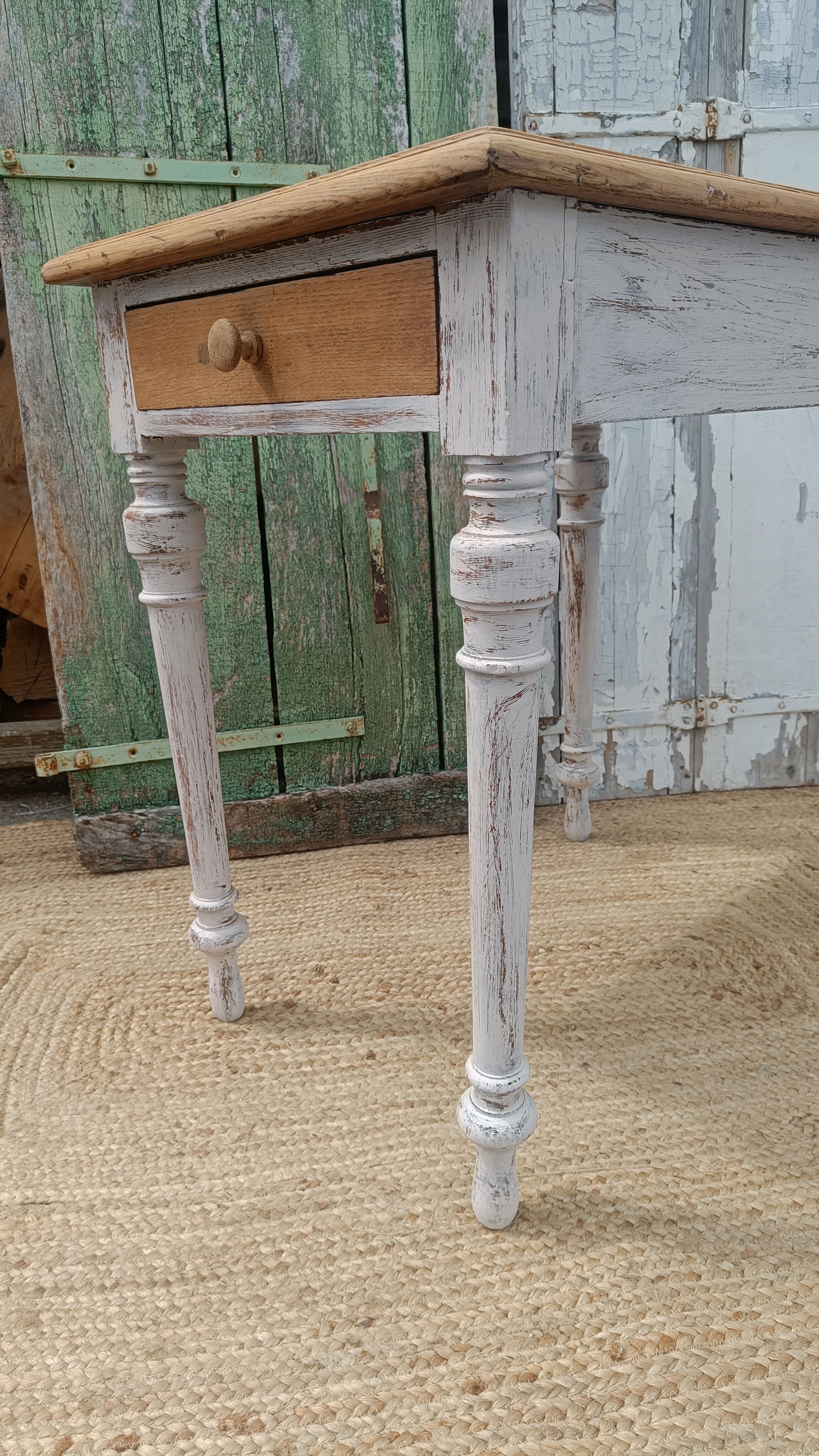 Antique drawer table with a patina.