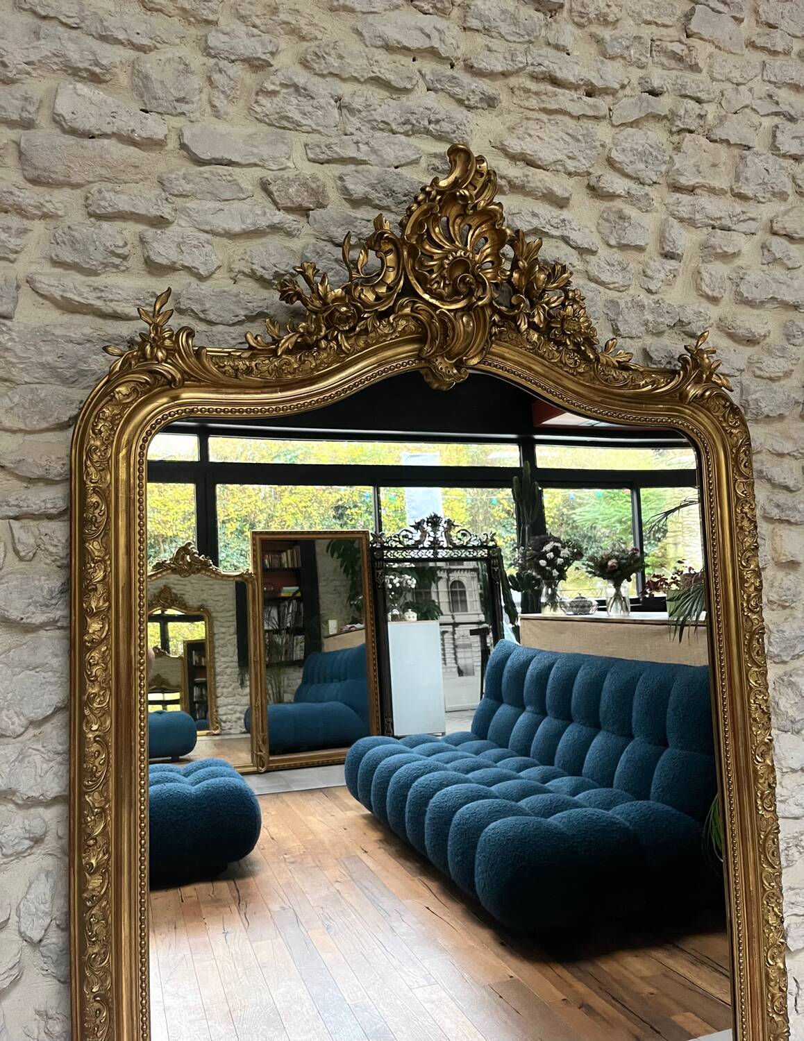 Antique mirror 183.5/116cm with pediments and pearl detailing in gold leaf.
