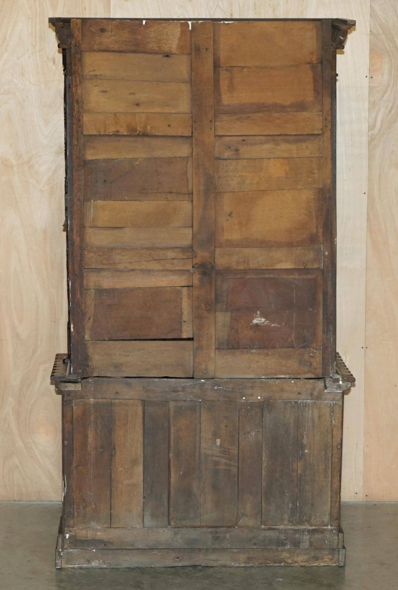 Jacobean hardwood library with carved panels and glass doors.