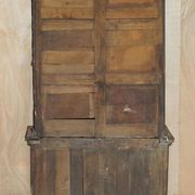 Jacobean hardwood library with carved panels and glass doors.