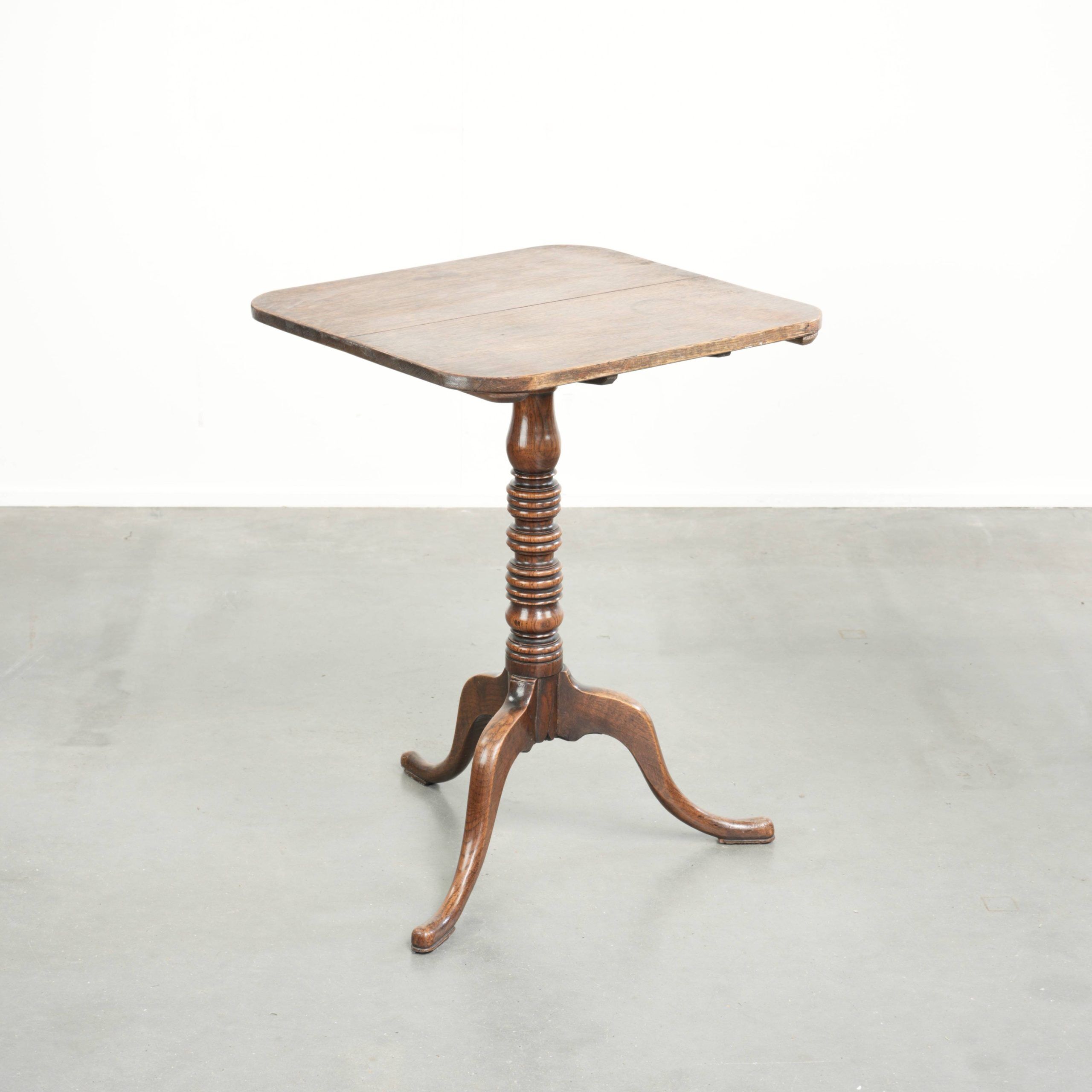 Antique English oak tilt top table from the 19th century in a unique shape