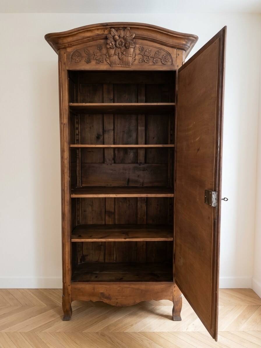 Antique carved wooden wardrobe with cornice.