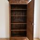 Antique carved wooden wardrobe with cornice.