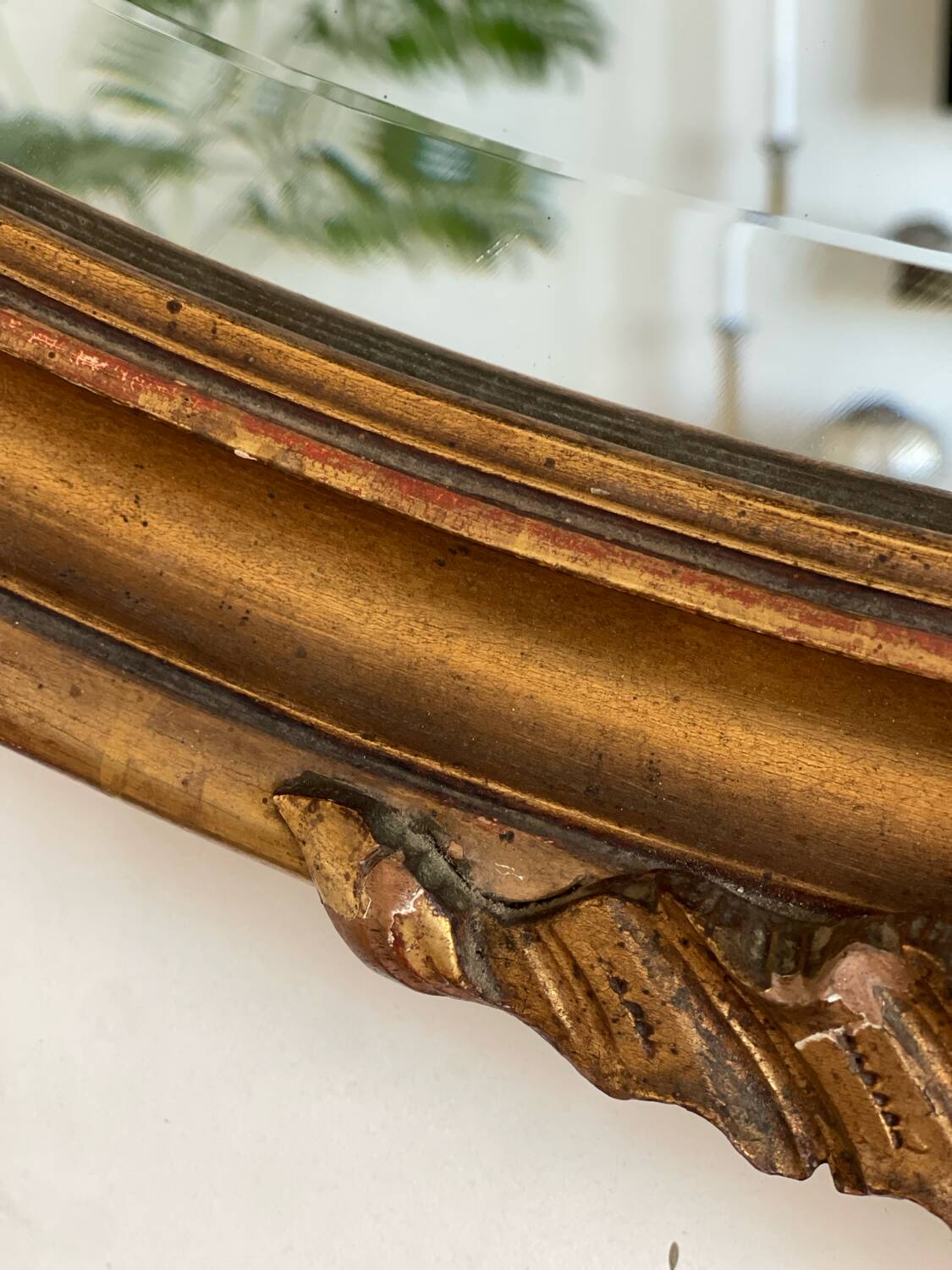 Antique oval gilt mirror.