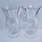 Pair of tall clear glass candlesticks from the early 20th century