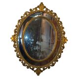 Miroir ovale en bois doré