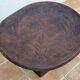 African monoxyle side table in carved wood with a curved top, 48x36 cm.