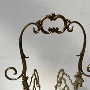 20th century openwork bronze and brass magazine rack