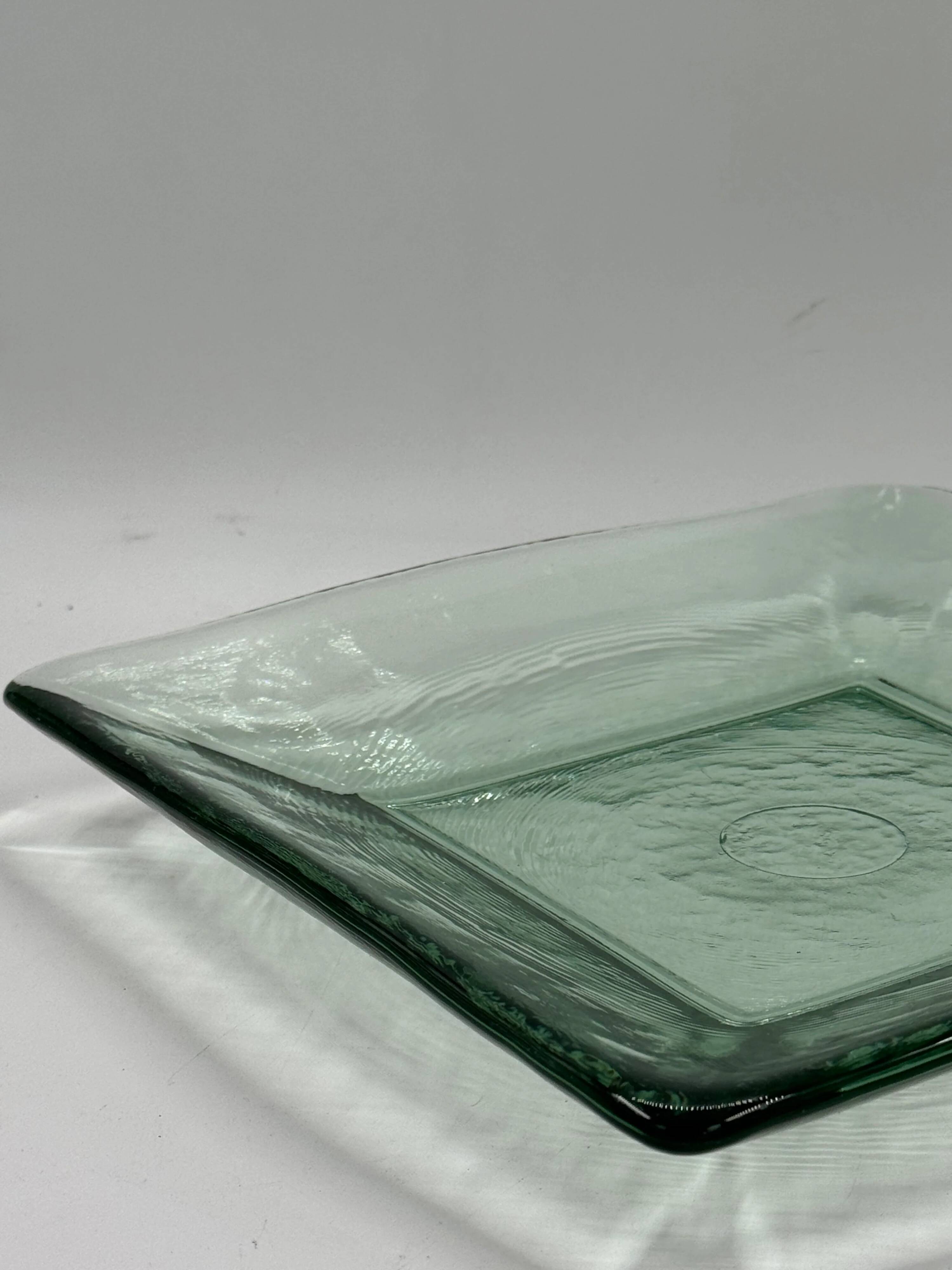 Square sculptural glass plate, textured wavy finish.