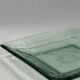 Square sculptural glass plate, textured wavy finish.