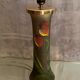 Pied de lampe en verre teinté à décor végétal émaillé