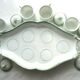 Porcelain cream service of Paris 1850, 6 pots on green and gold oval tray