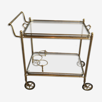 Neoclassical style rolling table in brass