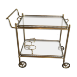 Neoclassical style rolling table in brass