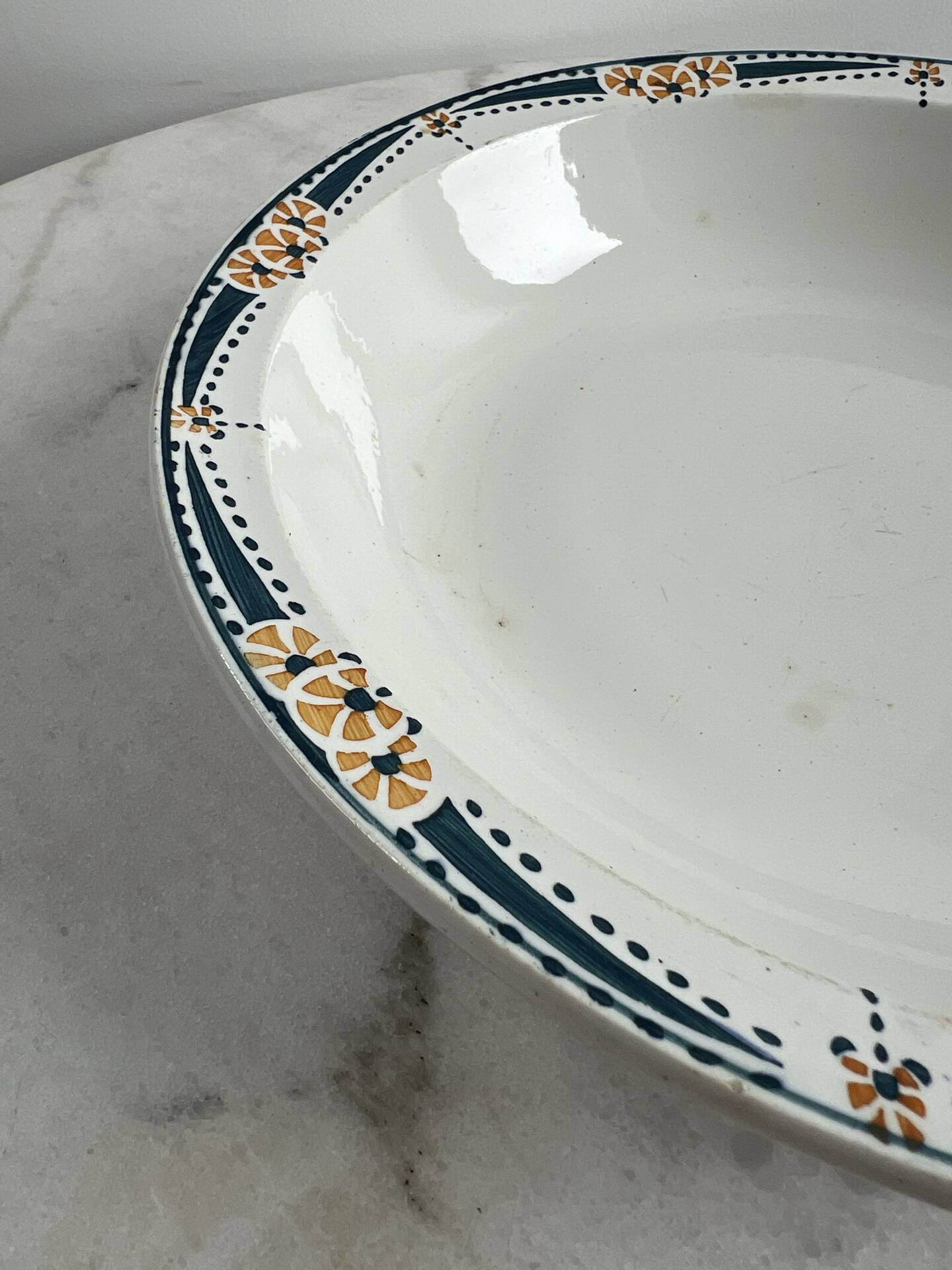 Longwy salad bowl with blue and orange floral decoration.
