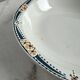 Longwy salad bowl with blue and orange floral decoration.