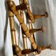 19th century turned wood accordion coat rack.