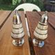 Antique salt and pepper shakers in mother-of-pearl.