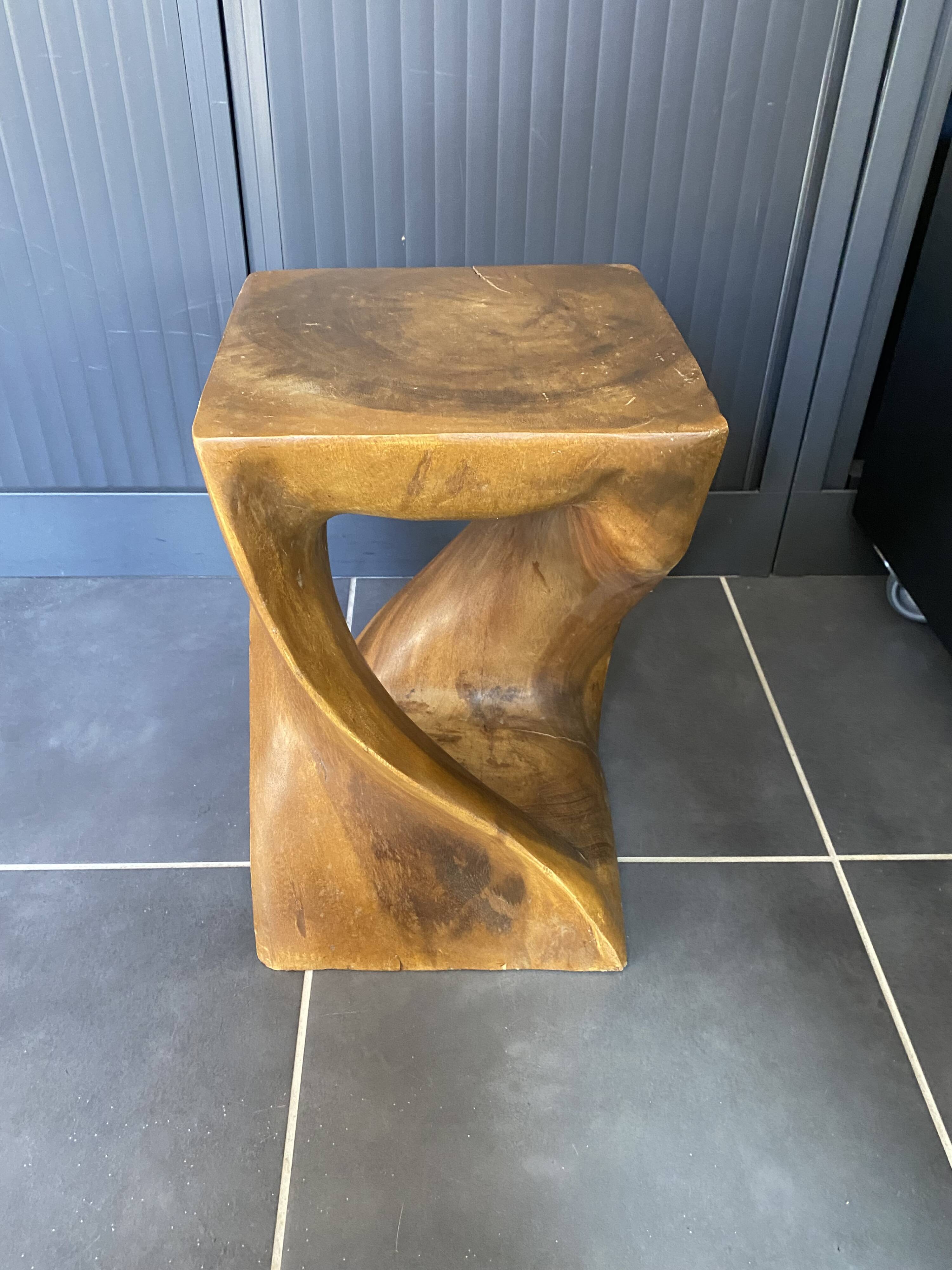 Stool no. 1 in solid raw walnut wood, carved from the mass, 1970.