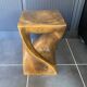 Stool no. 1 in solid raw walnut wood, carved from the mass, 1970.