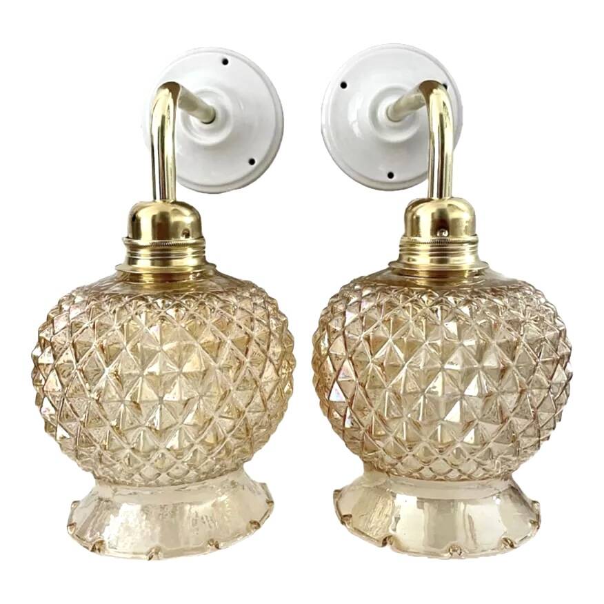 Pair of golden globe wall lights