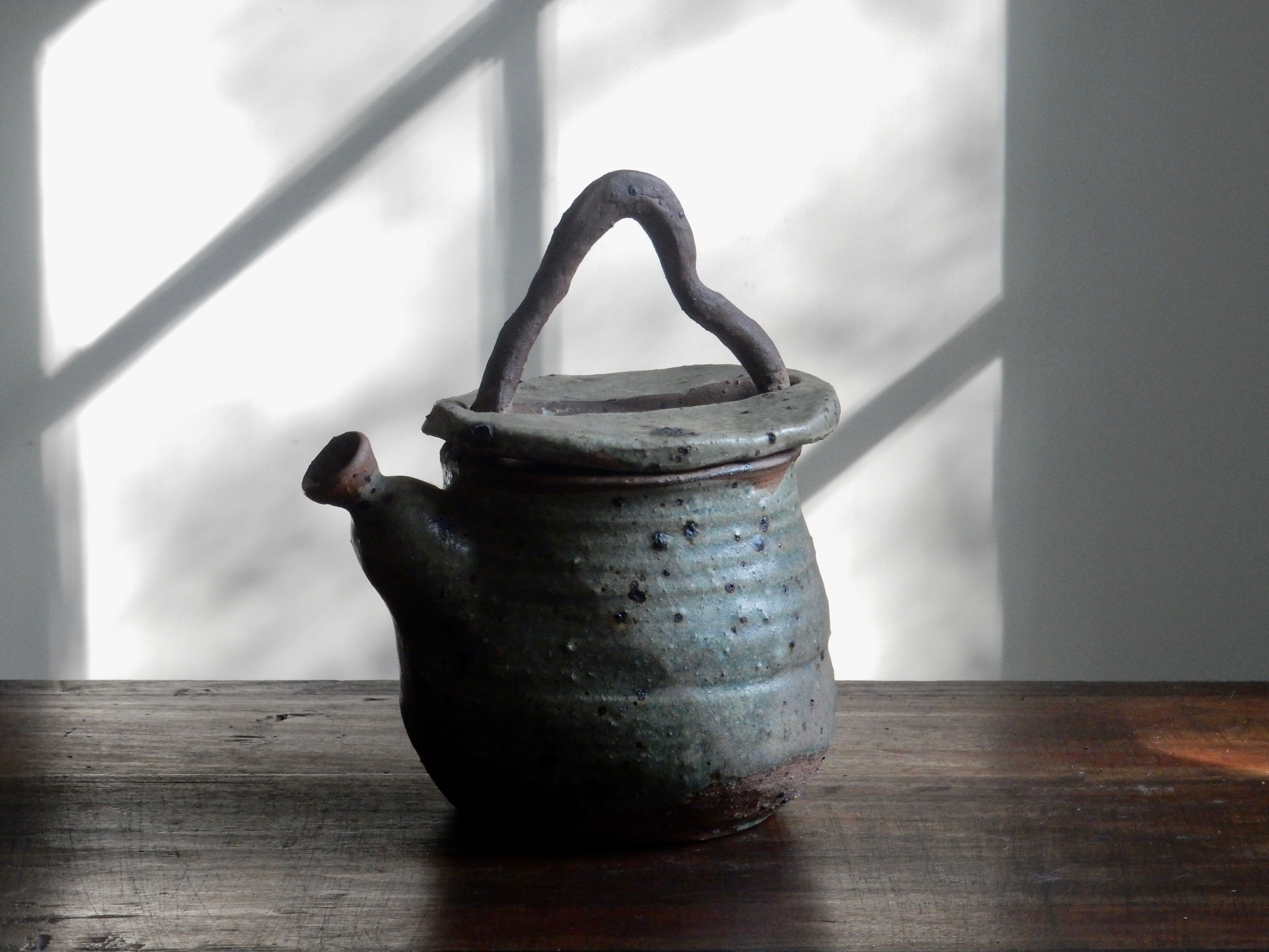 Homemade teapot in pyrity sandstone