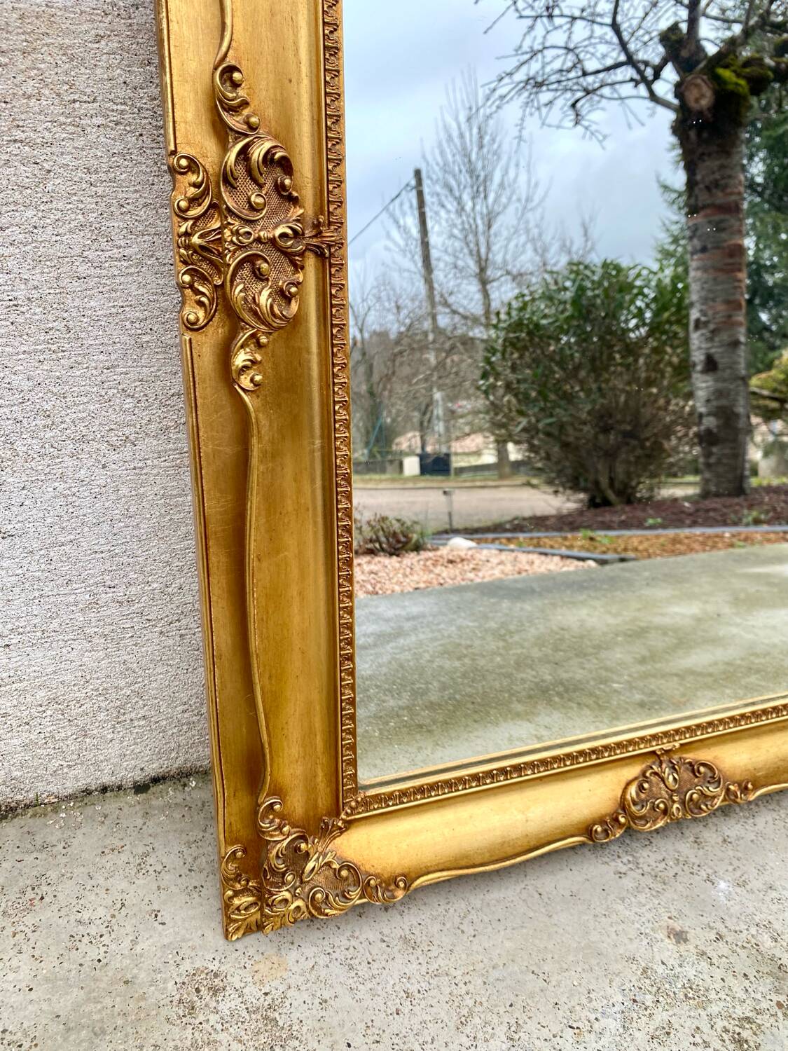 Miroir biseauté en bois doré