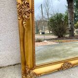 19th century style gilded wooden beveled mirror with ornate corners