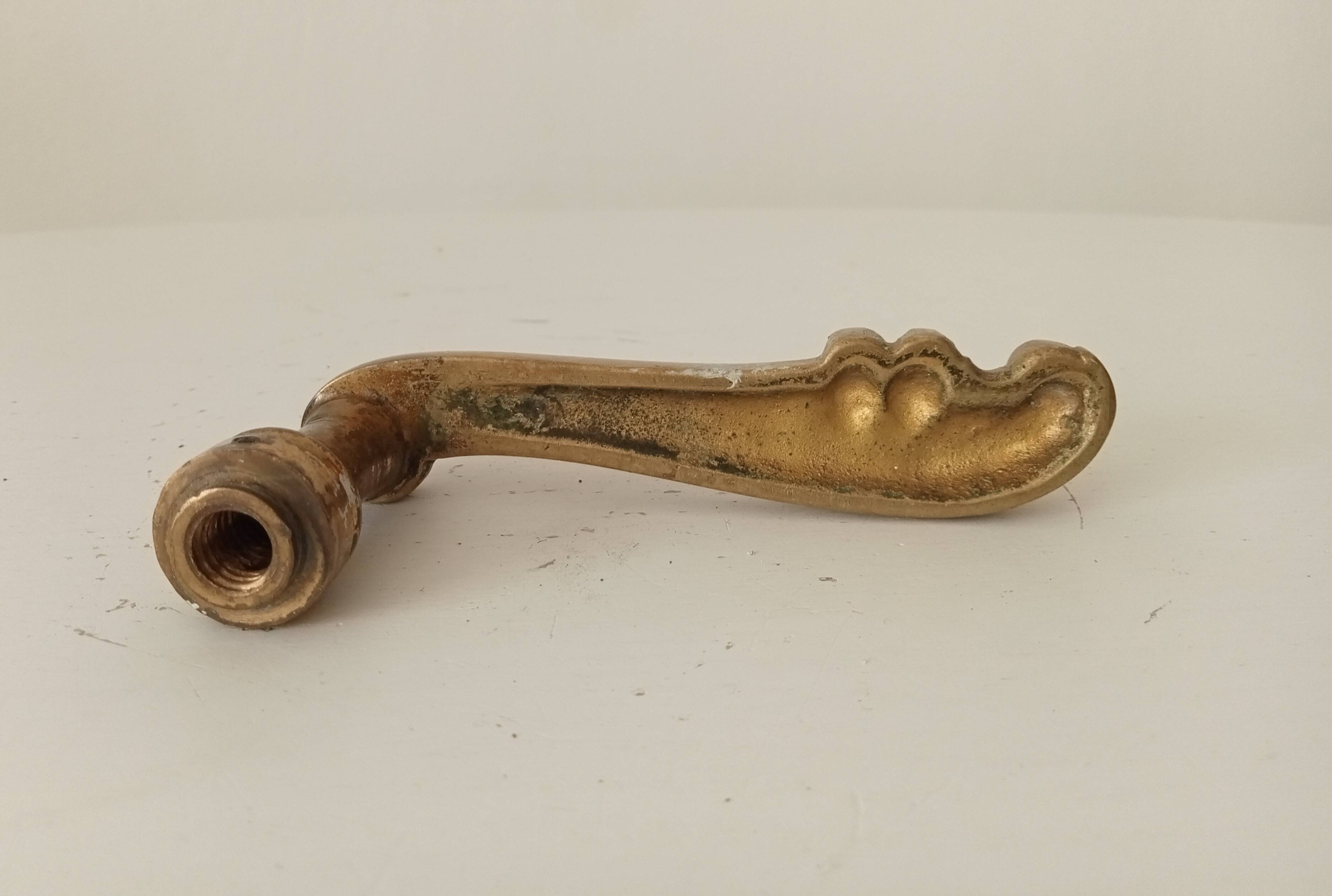 Antique bronze door handle in Empire style