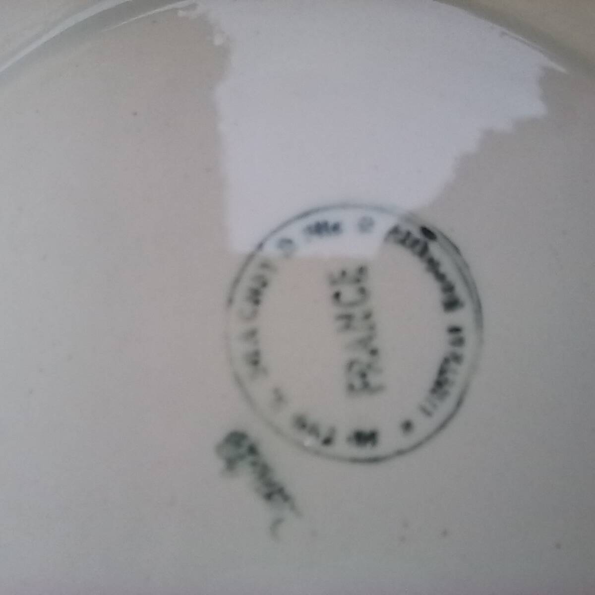 Old presentation plate on red rose foot