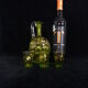 Small carafe and green glass drop glasses with rococo golden emailed decor