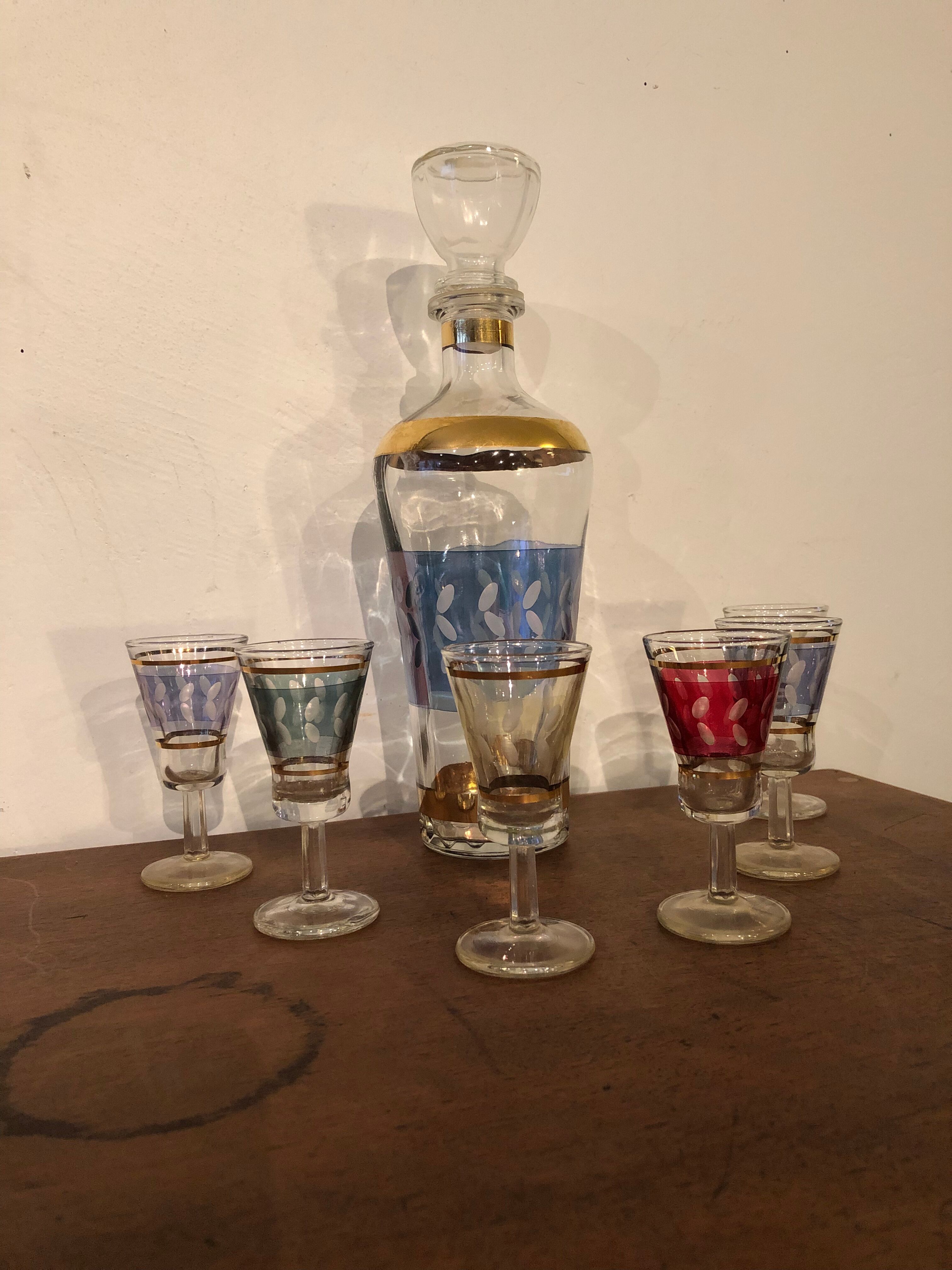 Liquor carafe and 6 assorted glasses