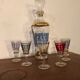 Liquor carafe and 6 assorted glasses