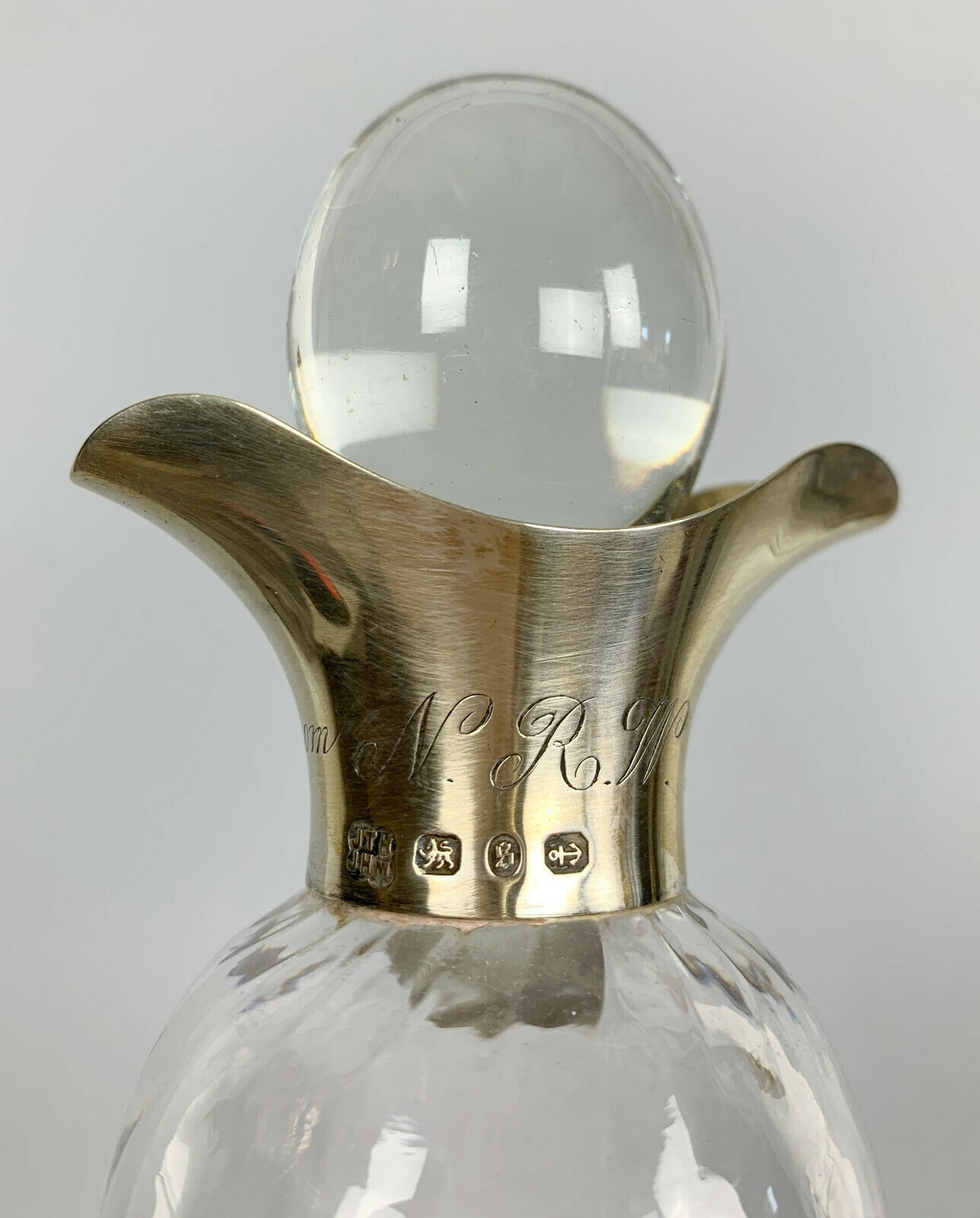 Blown glass carafe with silver frame