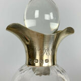 Blown glass carafe with silver frame