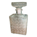 Old molded glass whiskey bottle