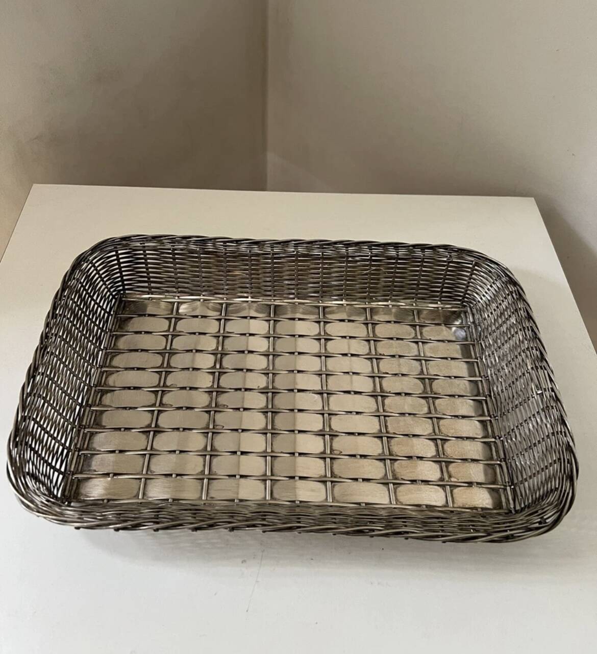 Woven silver metal bread basket