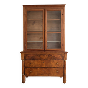 Antique wooden storage cabinet with display case.