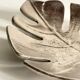 Leaf-shaped metal pocket emptier